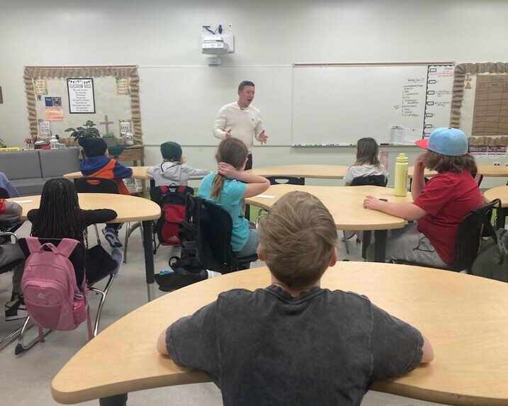 Students listen as Josh Classen talks passionately about the weather.