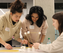 Council members building a marshmallow tower