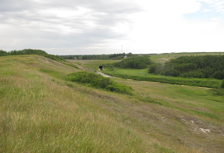 View of the Gibbons escarpment a view looking north, with the Sturgeon River and some badlands outcroppings.